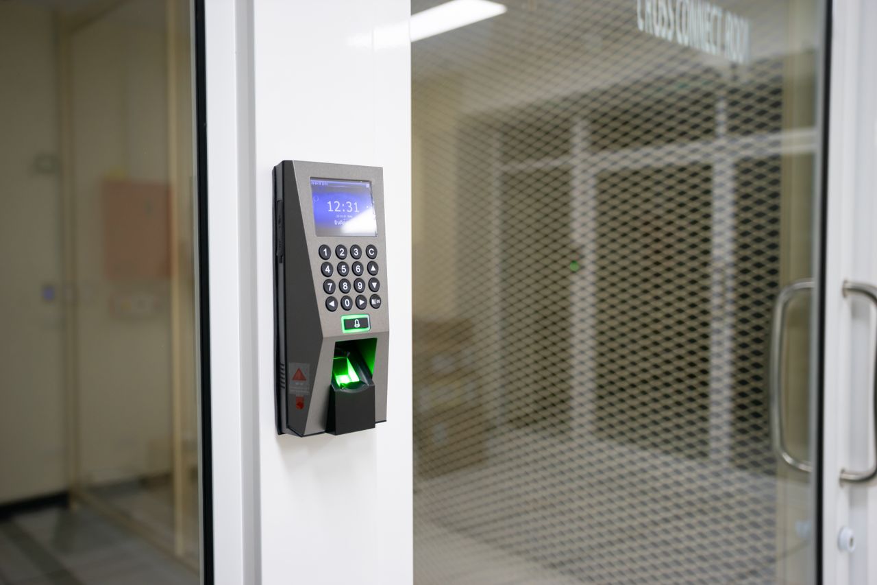 Services A modern fingerprint scanner for secure access control in an office environment.